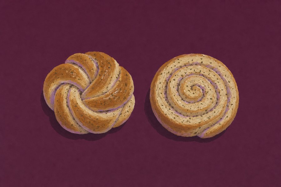 Two cardamom buns on a plum ground. On the left one rope of dough tied into a knot; on the right the same dough as a cut spiral laid cut-face up so the coil shows. Both are flecked with crushed cardamom.